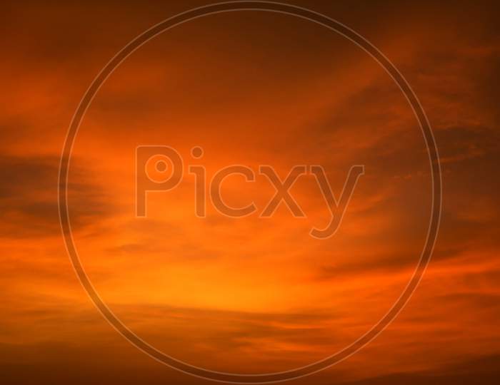 Orange sunset sky. Beautiful sky in the Evening, Cloudy sky