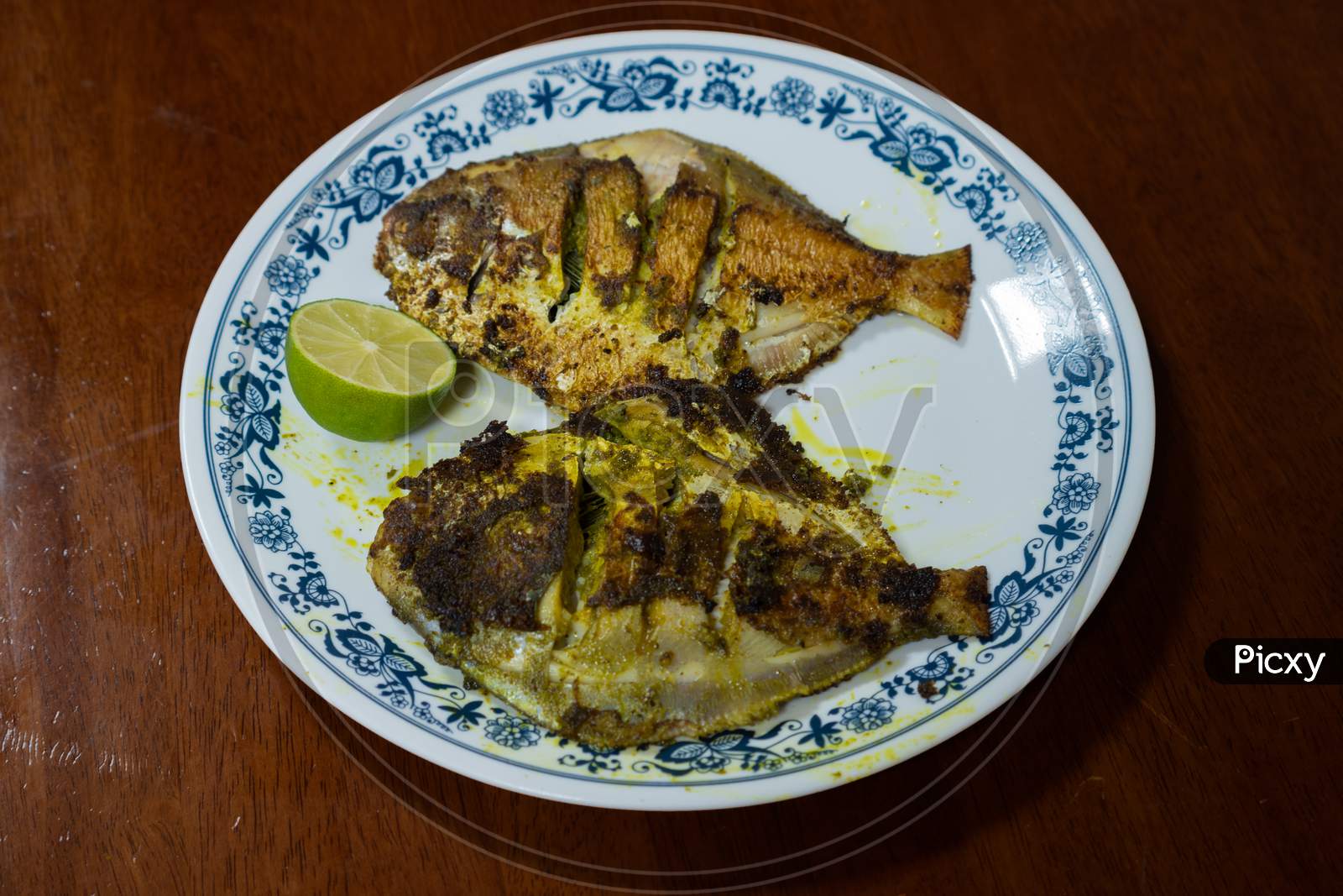 Fried Fish Served On A Plate