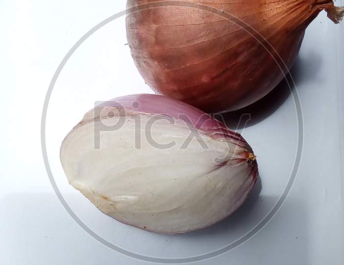 Half cutd and a one whole onion background white
