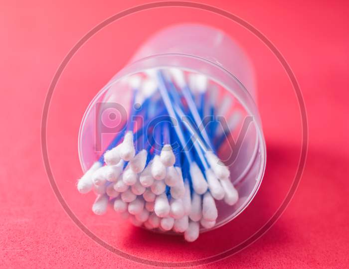 Cotton Swabs On A Red Background