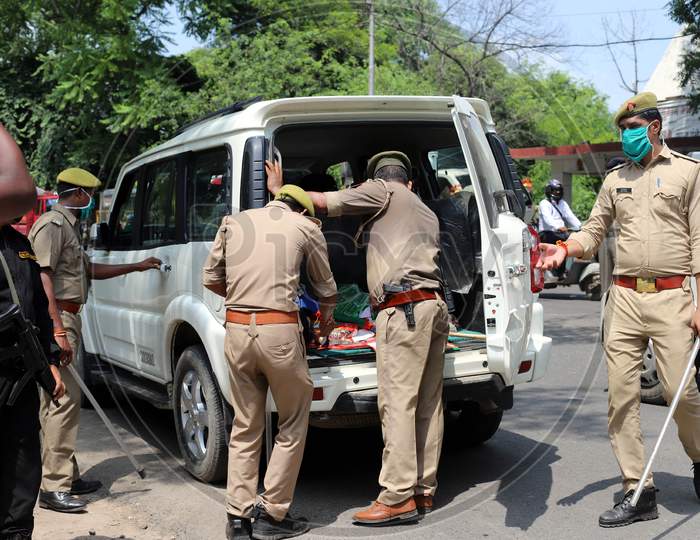 Police on high alert as they check vehicles ahead of Ayodhya's Ram Mandir ceremony, in Prayagraj, August 4, 2020.