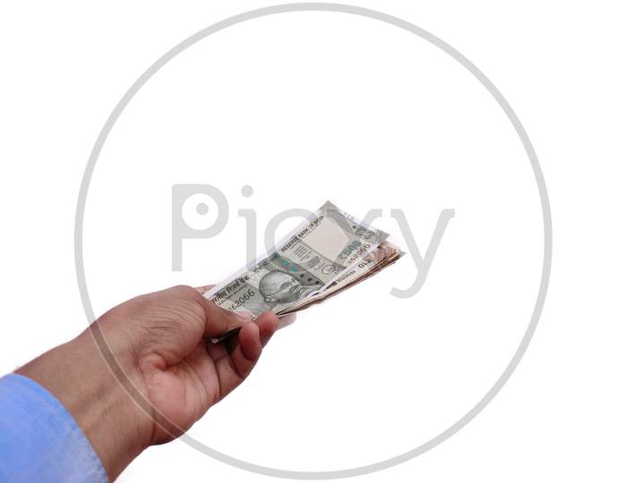 Indian Banknote in hand offering money Concept on White background