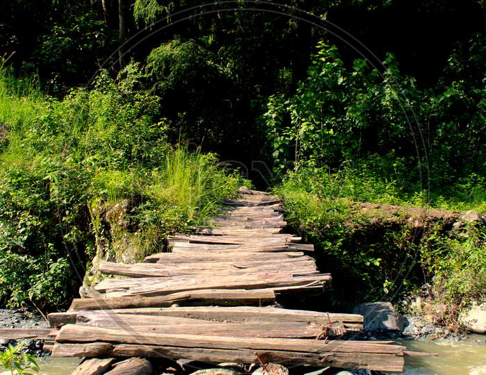 Small wooden bridge over river