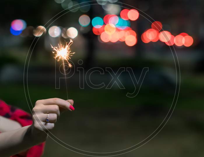 Firework In Hand On Defocus Background