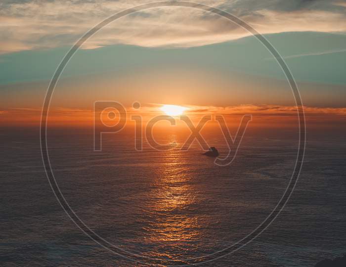Shot From The Cliffs Of A Colorful Sunset Over The Ocean