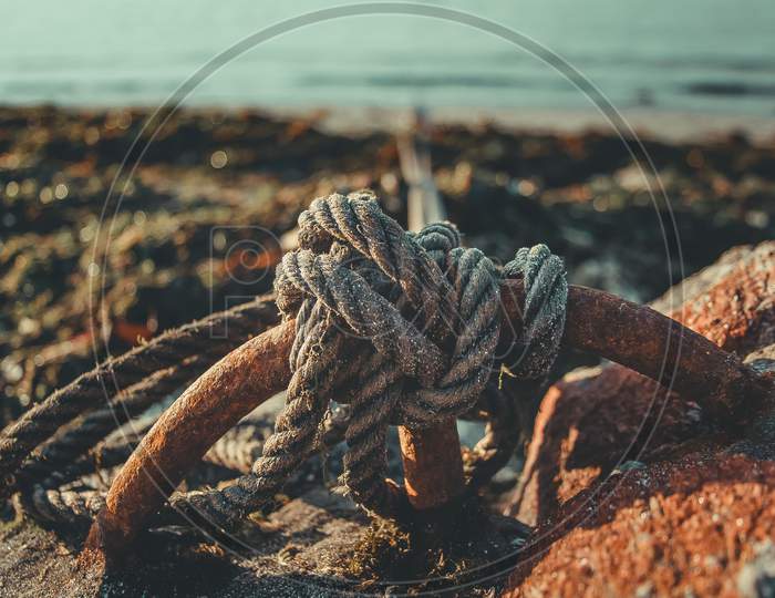 Knot Of A Boat Cord In The Coast Near The Beach