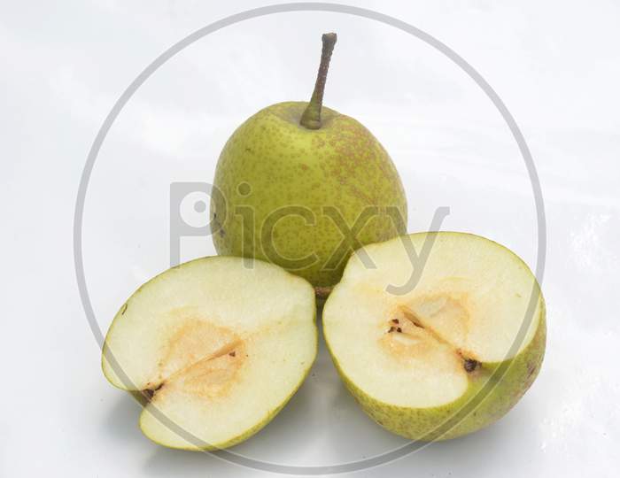 The Green Ripe Sliced Pear Isolated On White Background