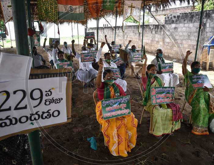Farmers Hold Placards As They Protest Against Governor Biswabhusan Harichandan'S Approval For Three Capitals For The State Of Andhra Pradesh, At Mandadam In Guntur District, August 02, 2020.