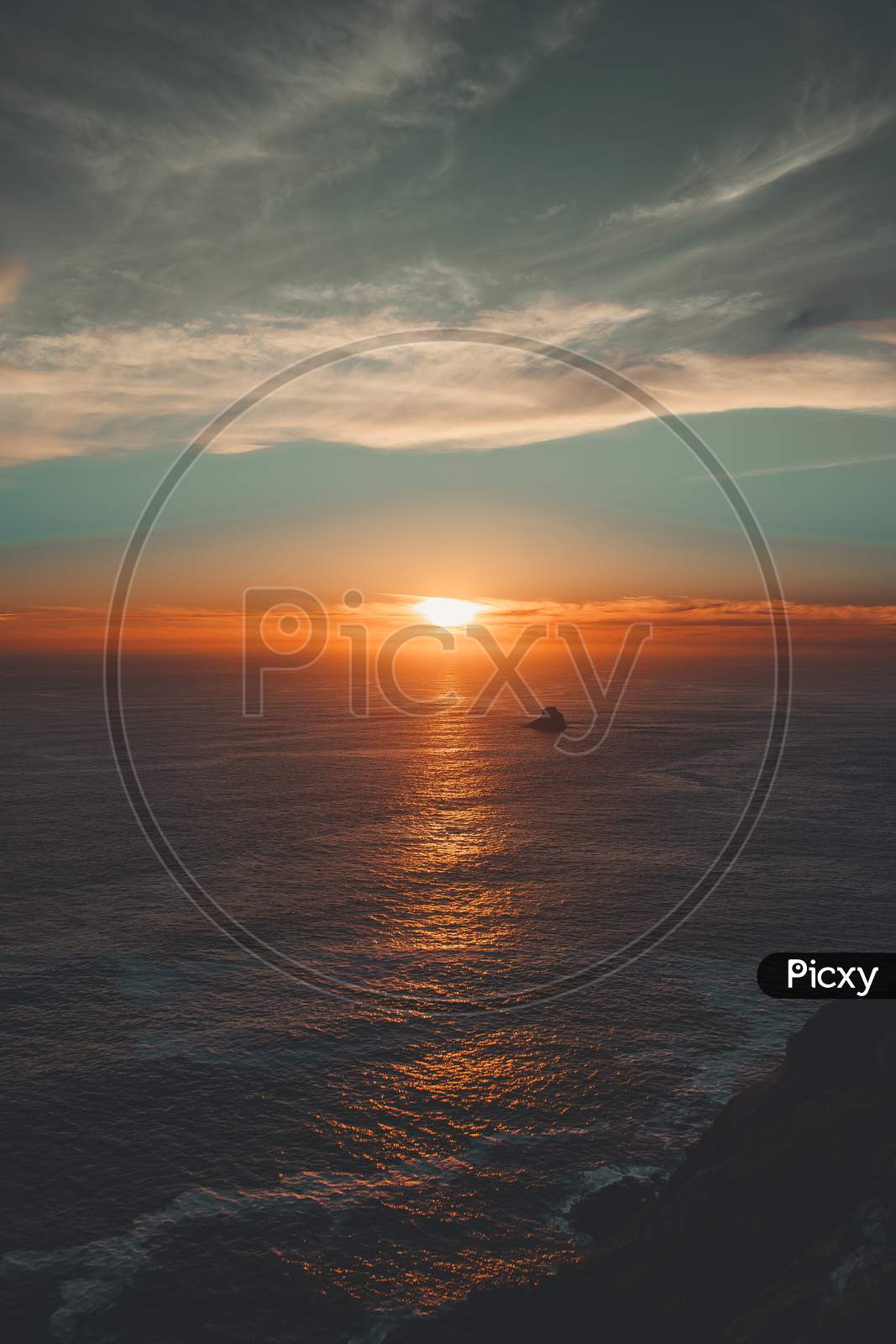 Shot From The Cliffs Of A Colorful Sunset Over The Ocean