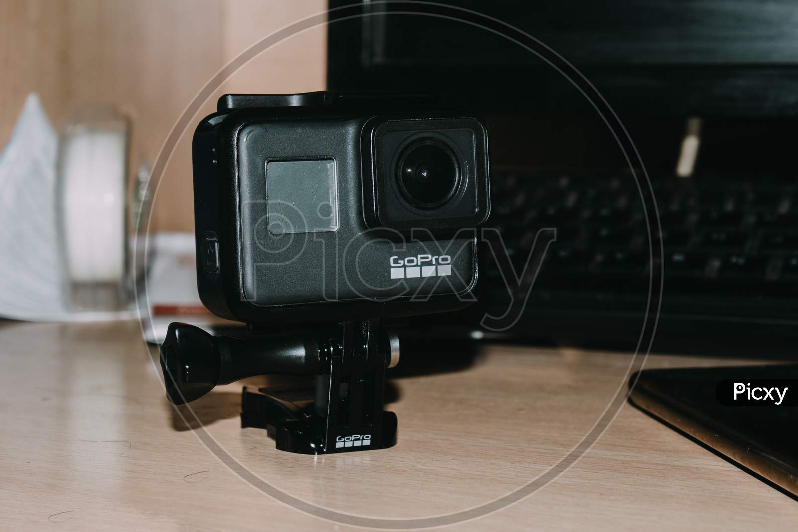 Delhi, India - April 30 2020: Action Camera In Mount Stand Clipping Clamp On Table, Gopro Hero 7 Black