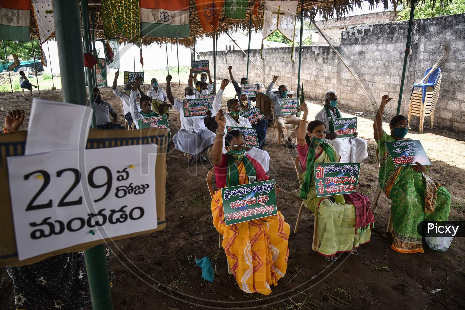 Farmers Hold Placards As They Protest Against Governor Biswabhusan Harichandan'S Approval For Three Capitals For The State Of Andhra Pradesh, At Mandadam In Guntur District, August 02, 2020.