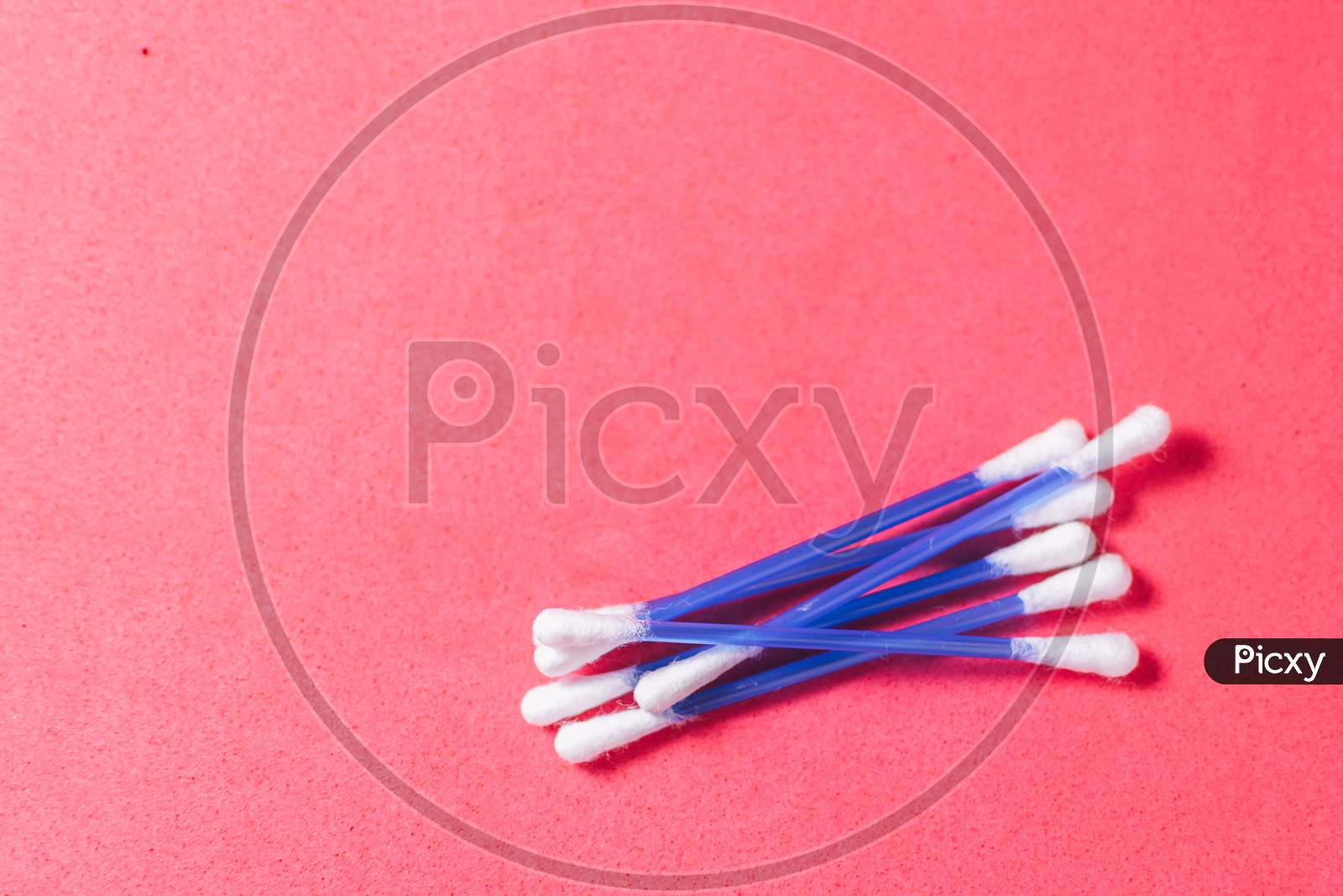 Cotton Swabs On A Red Background