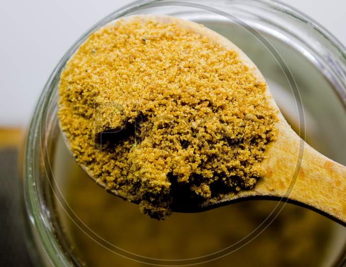 Close Up Of Natural Bio Coconut Sugar For Diet On A Wooden Spoon