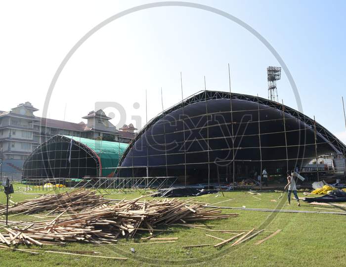 Labourers works for the construction of a COVID care centre at Nehru Stadium for the treatment of COVID-19 infected patients, in Guwahati on August 3,2020.