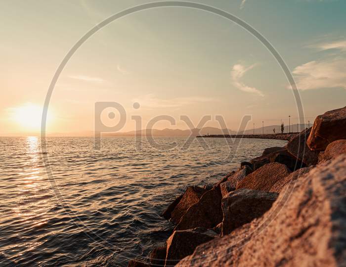 An Horizontal Shot Of The Sea From The Rocks On A Walk By A Spanish Port