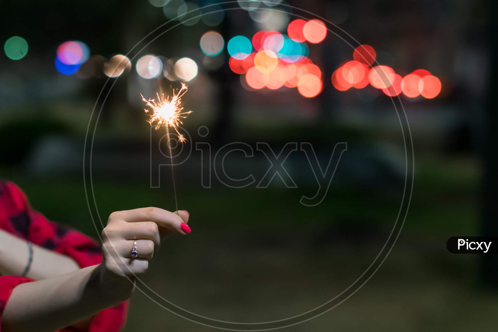 Firework In Hand On Defocus Background