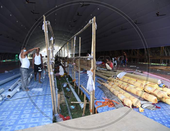 Labourers works for the construction of a COVID care centre at Nehru Stadium for the treatment of COVID-19 infected patients, in Guwahati on August 3,2020.