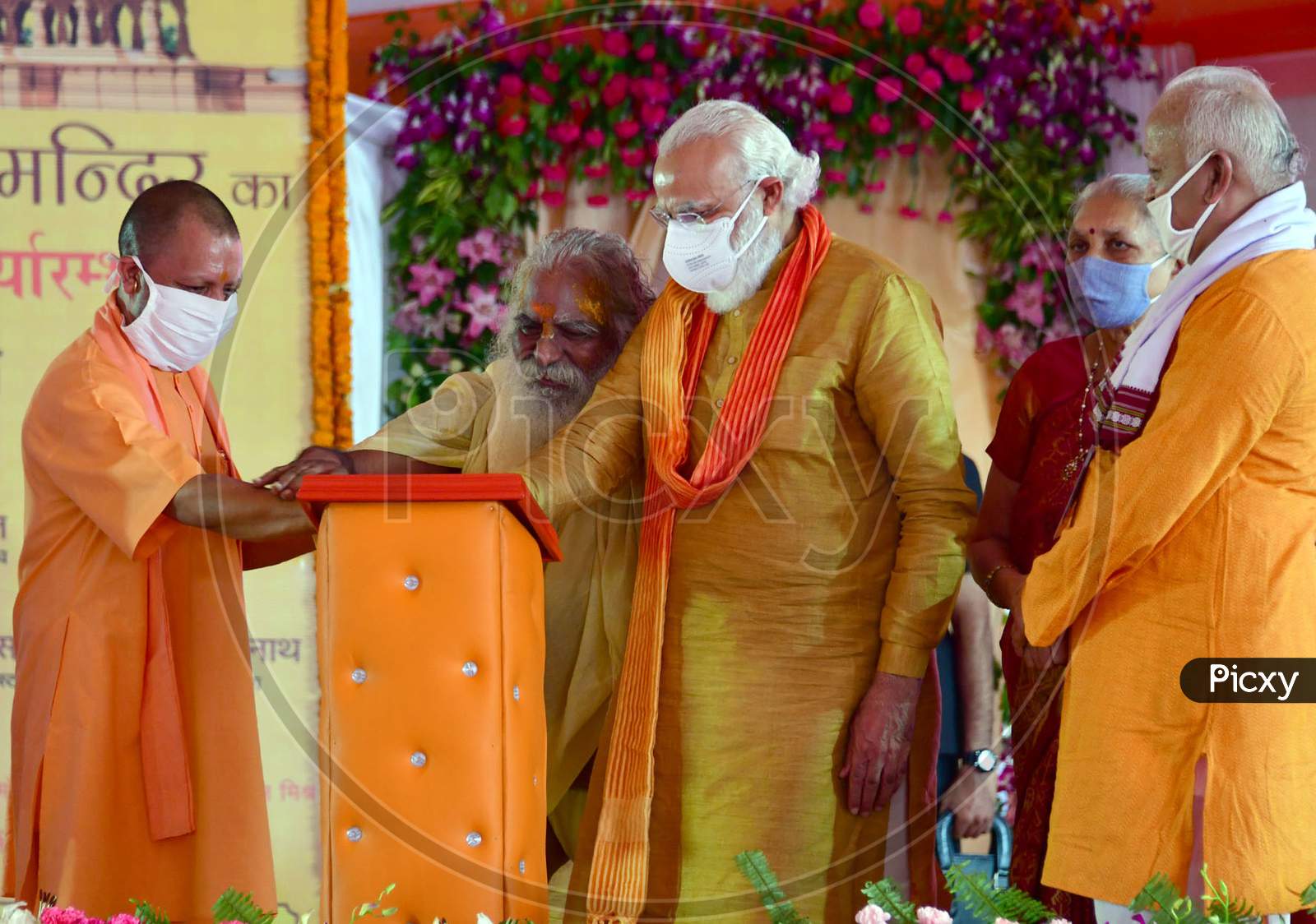 PM Narendra Modi, UP CM Yogi Adityanath, RSS chief Mohan Bhagwat, UP Governor Anandiben Patel and Nritya Gopal Das Launch the commemorative Postal Stamp after the foundation laying ceremony for the Hindu Lord Ram's temple, in Ayodhya, India, August 5, 2020.