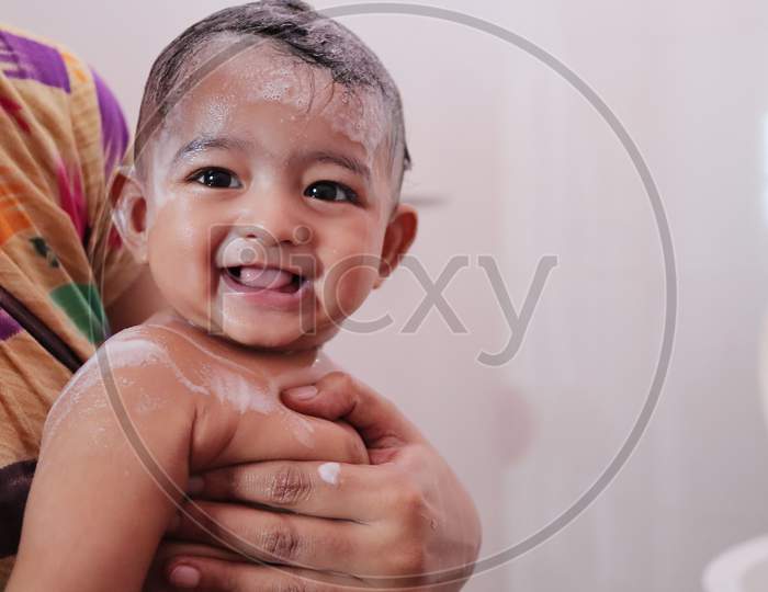 Indian Baby Enjoying Bubble Bath With Foam
