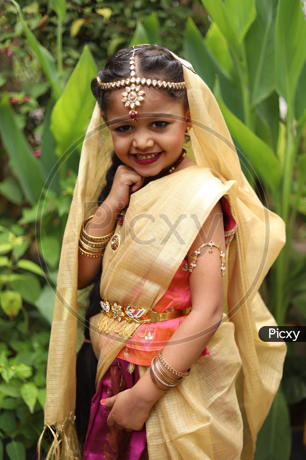 Image of Cute little girl dressed in traditional Indian sari to ...