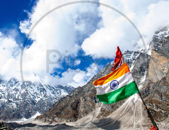 The Indian flag is waving in the sky at Himalayan mountain range in Satopanth Badrinath Uttarakhand India