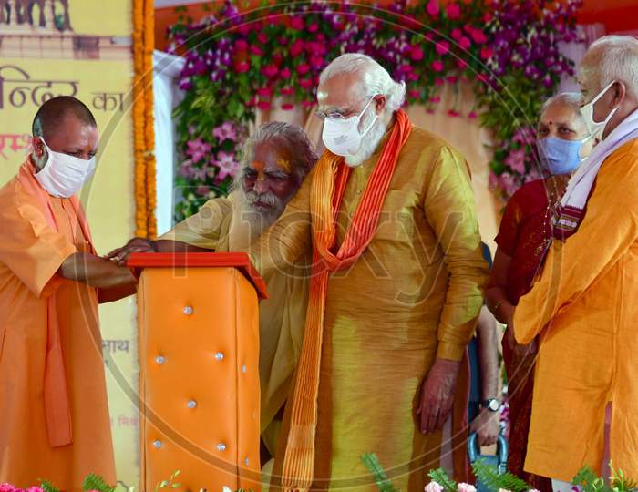 PM Narendra Modi, UP CM Yogi Adityanath, RSS chief Mohan Bhagwat, UP Governor Anandiben Patel and Nritya Gopal Das Launch the commemorative Postal Stamp after the foundation laying ceremony for the Hindu Lord Ram's temple, in Ayodhya, India, August 5, 2020.