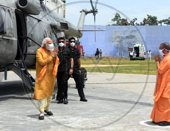 Uttar Pradesh Chief Minister Yogi Adityanath greets Prime Minister Narendra Modi as he arrives to take part in the foundation laying ceremony for Hindu Lord Ram's temple in Ayodhya, India, August 5, 2020.