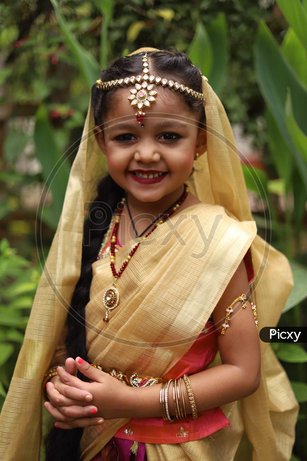 Image of Cute little girl dressed in traditional Indian sari to ...