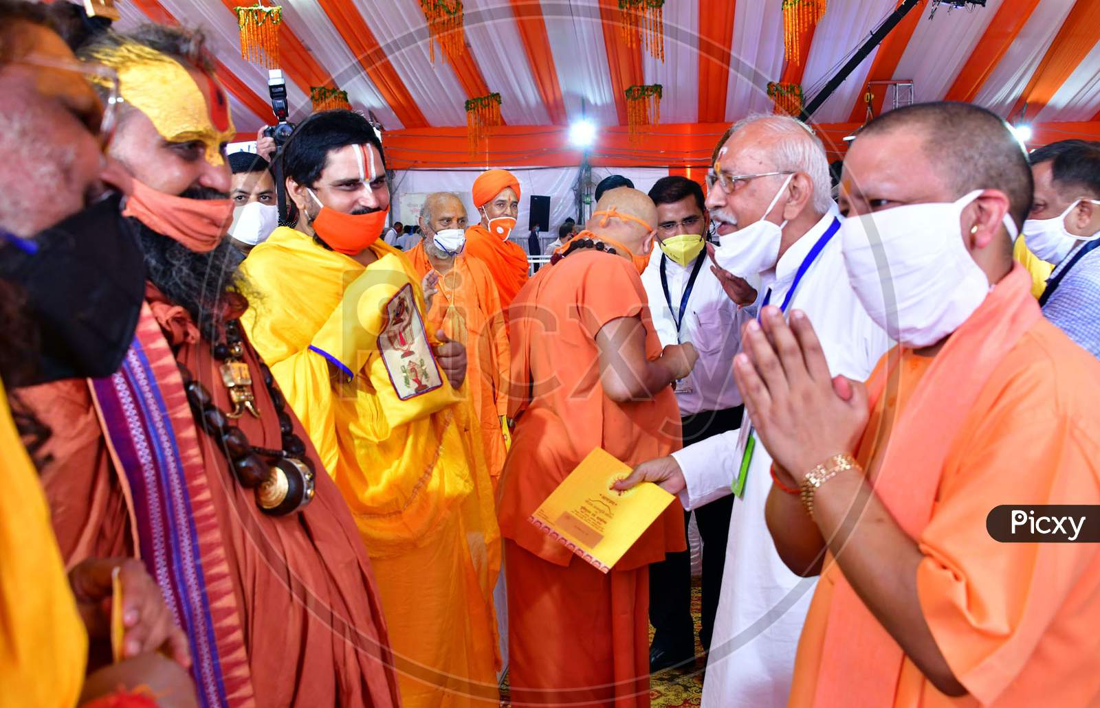 Uttar Pradesh Chief Minister Yogi Adityanath greets the local priests and Sadhus after the foundation laying ceremony for the Hindu Lord Ram's temple, in Ayodhya, India, August 5, 2020.