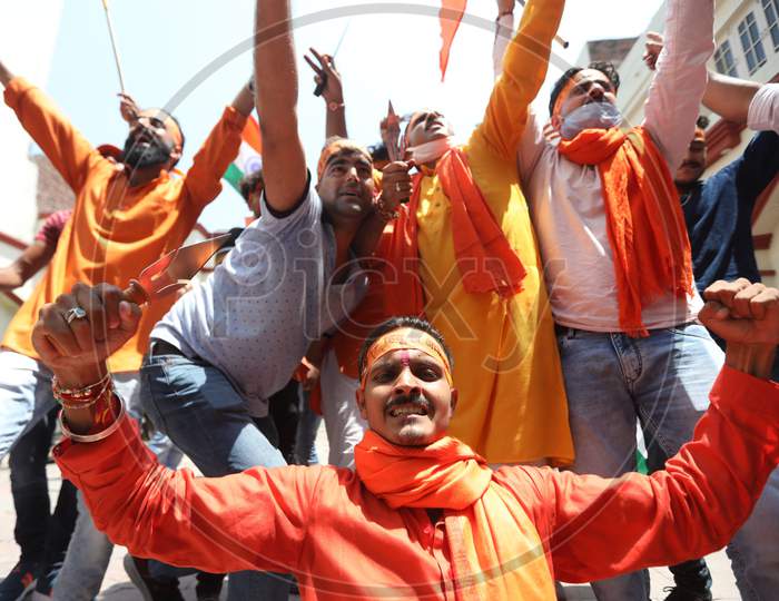 Activists of Rashtriya Bajrang Dal participate in a ceremony to mark the groundbreaking ceremony of a temple dedicated to the Hindu god Ram in Ayodhya,   in Jammu on August 5,2020.