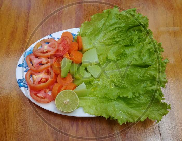 Brazilian salad with lettuce, carrot, tomato, chayote and lemon