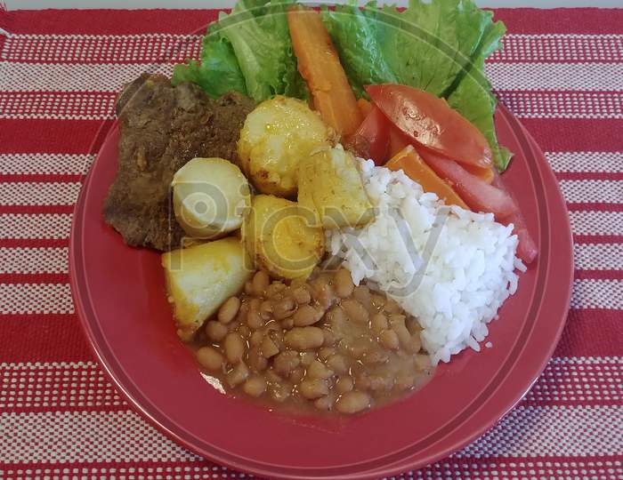 Traditional lunch plate with meat and vegetables