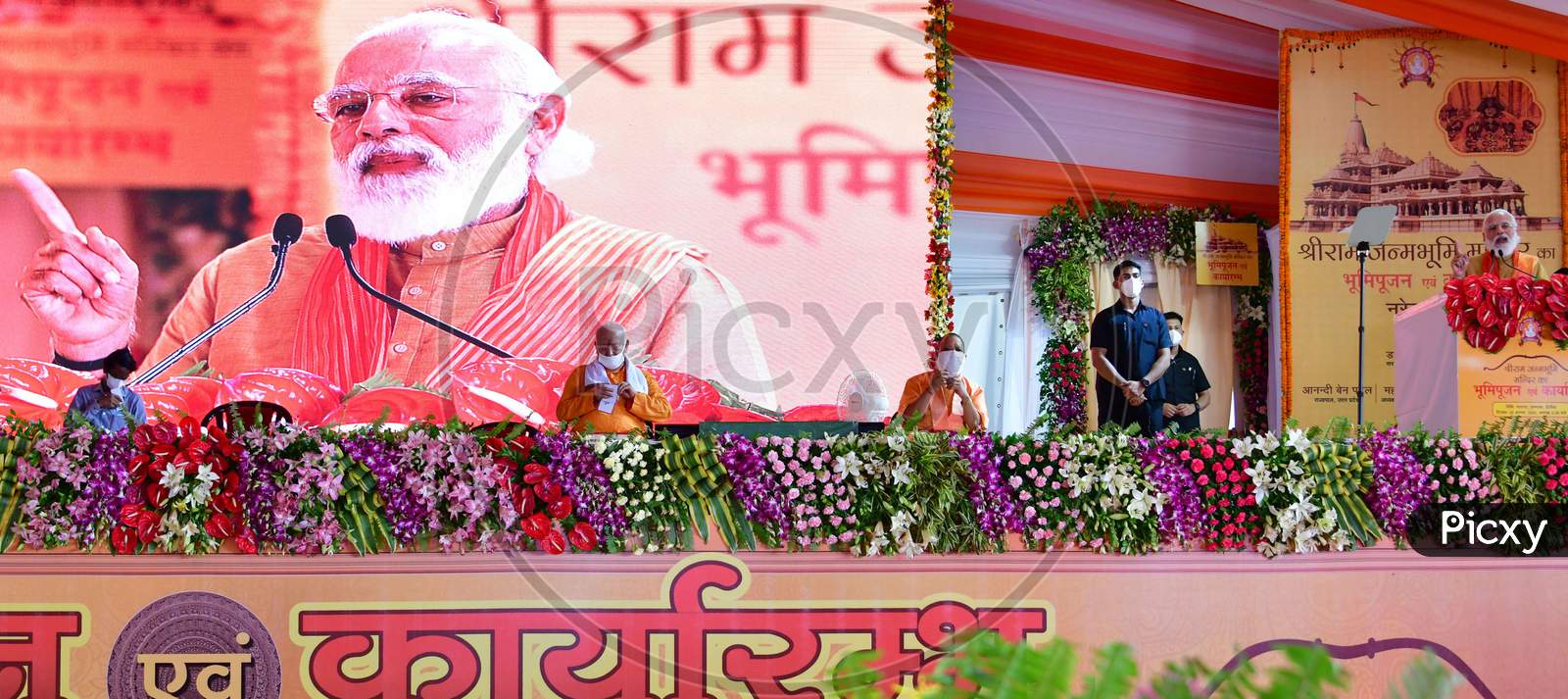 Prime Minister Narendra Modi, along with Uttar Pradesh Chief Minister Yogi Adityanath and Rashtriya Swayamsevak Sangh (RSS) chief Mohan Bhagwat, address people after the foundation laying ceremony for the Hindu Lord Ram's temple, in Ayodhya, India, August 5, 2020.