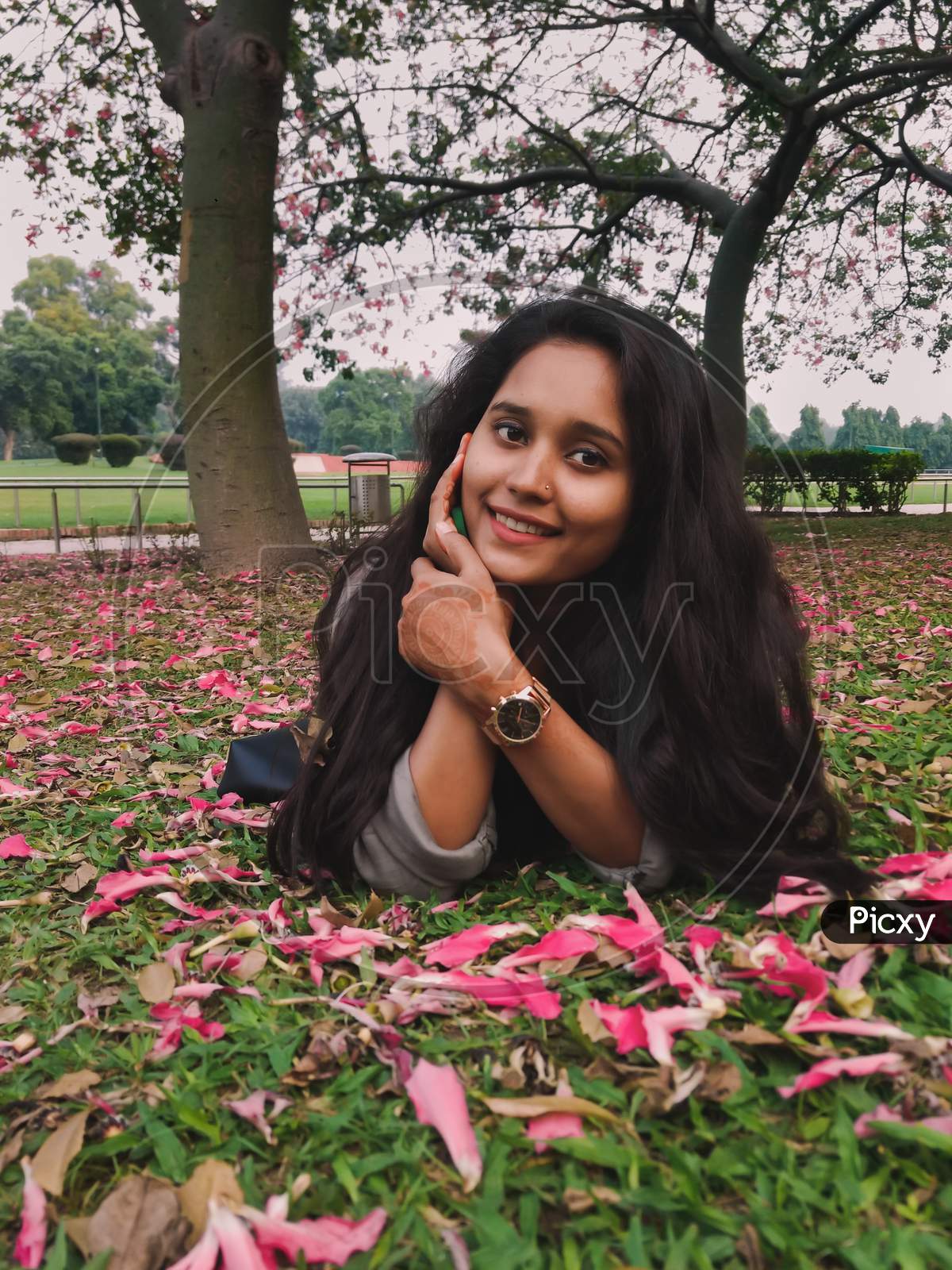 Image Of Portrait Of Beautiful Indian Girl Smiling With Perfect Smile And White Teeth In A Park