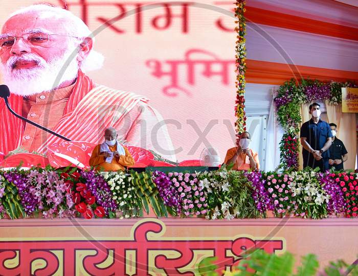 Prime Minister Narendra Modi, along with Uttar Pradesh Chief Minister Yogi Adityanath and Rashtriya Swayamsevak Sangh (RSS) chief Mohan Bhagwat, address people after the foundation laying ceremony for the Hindu Lord Ram's temple, in Ayodhya, India, August 5, 2020.