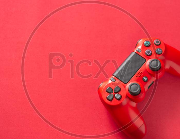 PS4 red joystick on a red background