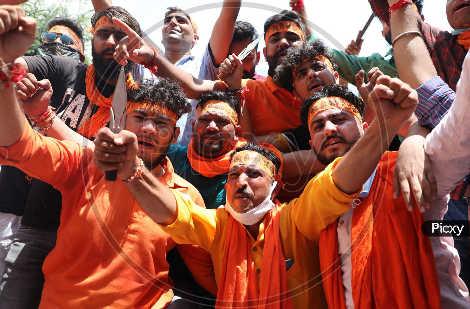 Activists of Rashtriya Bajrang Dal participate in a ceremony to mark the groundbreaking ceremony of a temple dedicated to the Hindu god Ram in Ayodhya,   in Jammu on August 5,2020.