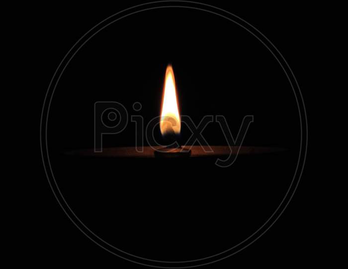 Full Dark Photo Of A Diya (Lamp).