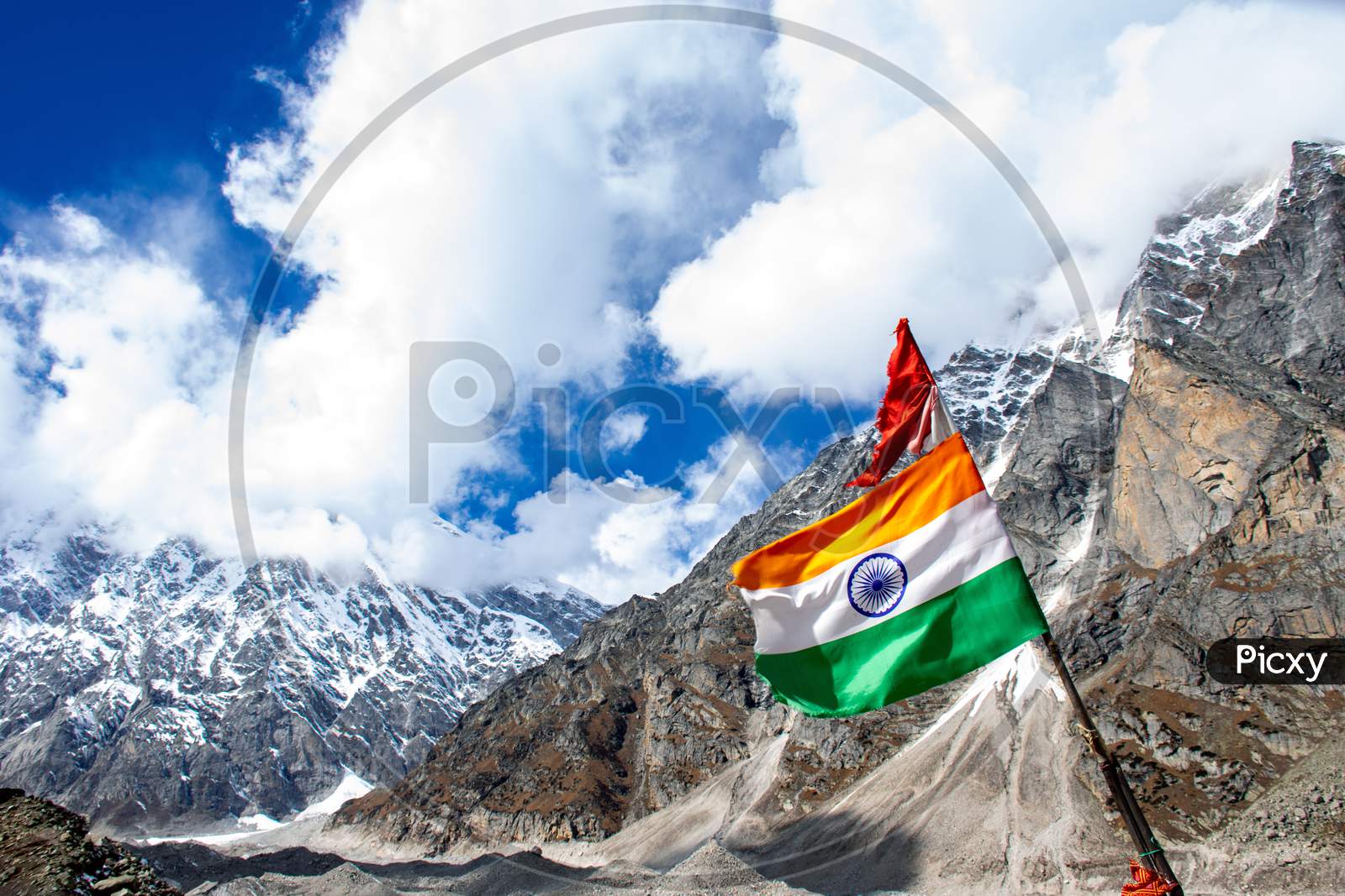 The Indian flag is waving in the sky at Himalayan mountain range in Satopanth Badrinath Uttarakhand India