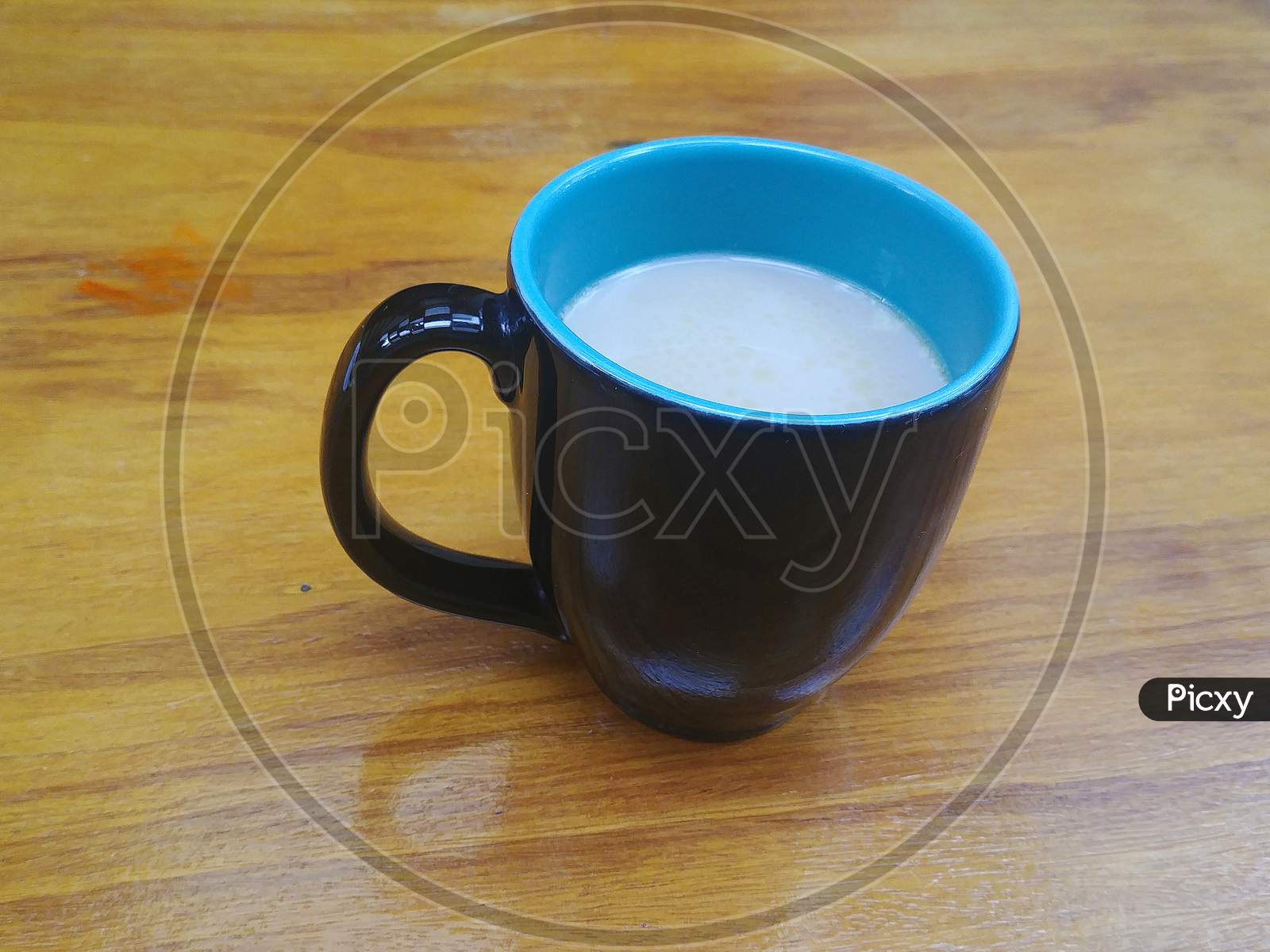 Mug with coffee with milk