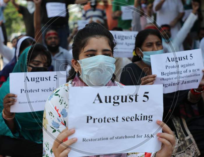 Panthers Party activists raise slogans during a protest against the scrapping of Article 370 and the bifurcation of Jammu and Kashmir, in Jammu on August 5,2020.