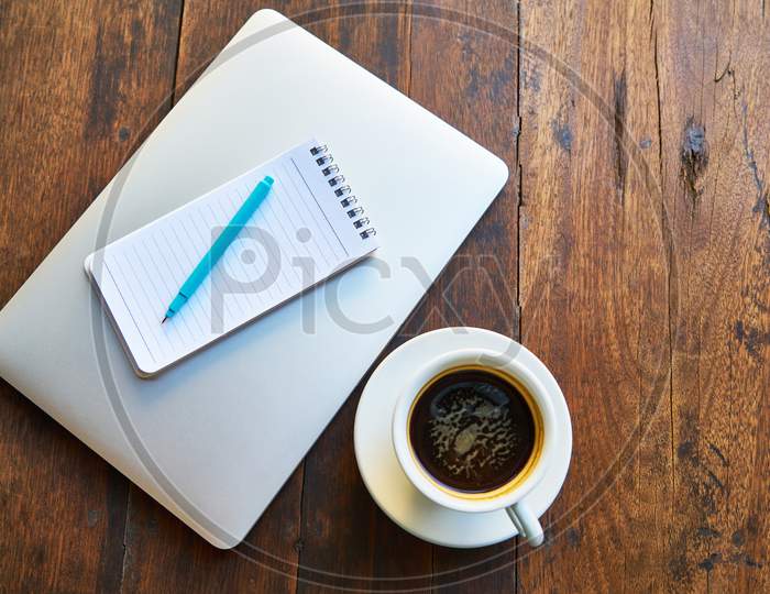 hot coffee with notebook
