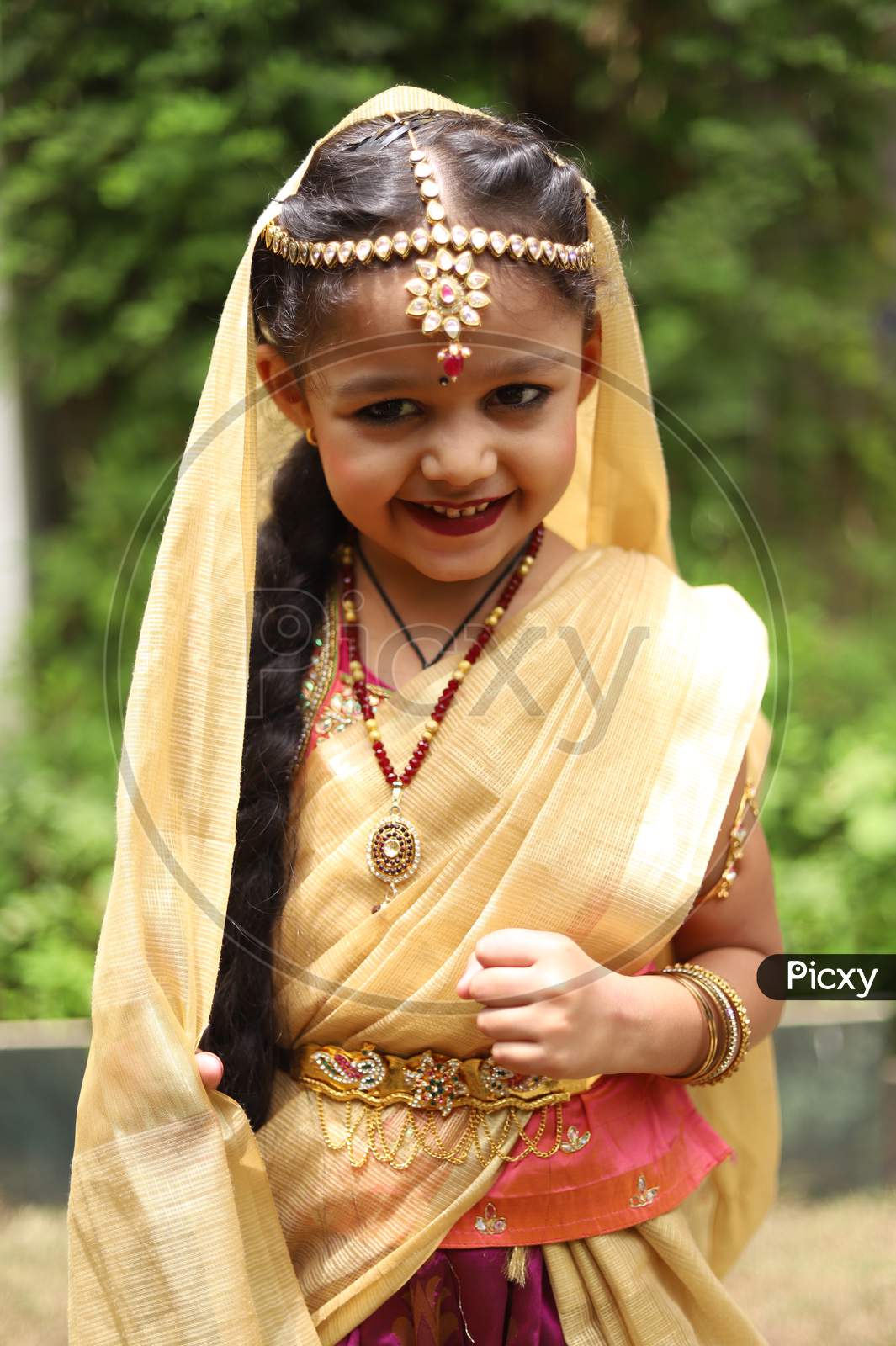 Image of Cute little girl dressed in traditional Indian sari to ...