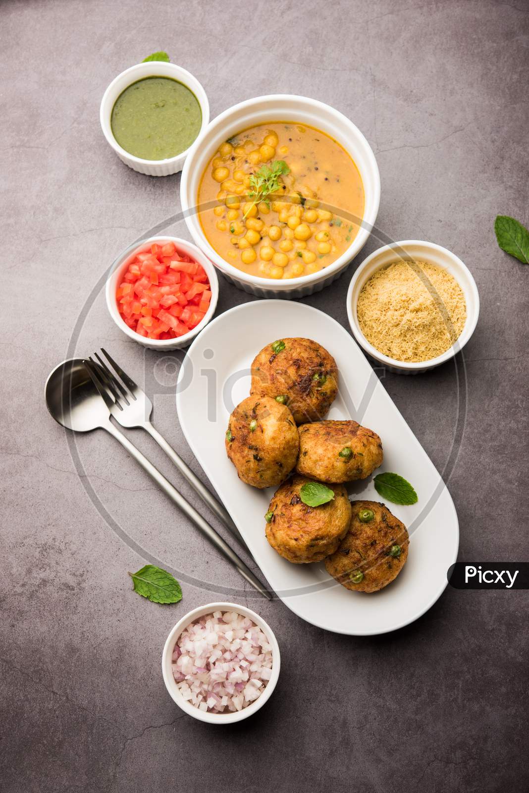 Indian Aloo Tikki Or Potato Cutlet Is Made Out Of Boiled Potatoes, Peas, And Various Curry Spices
