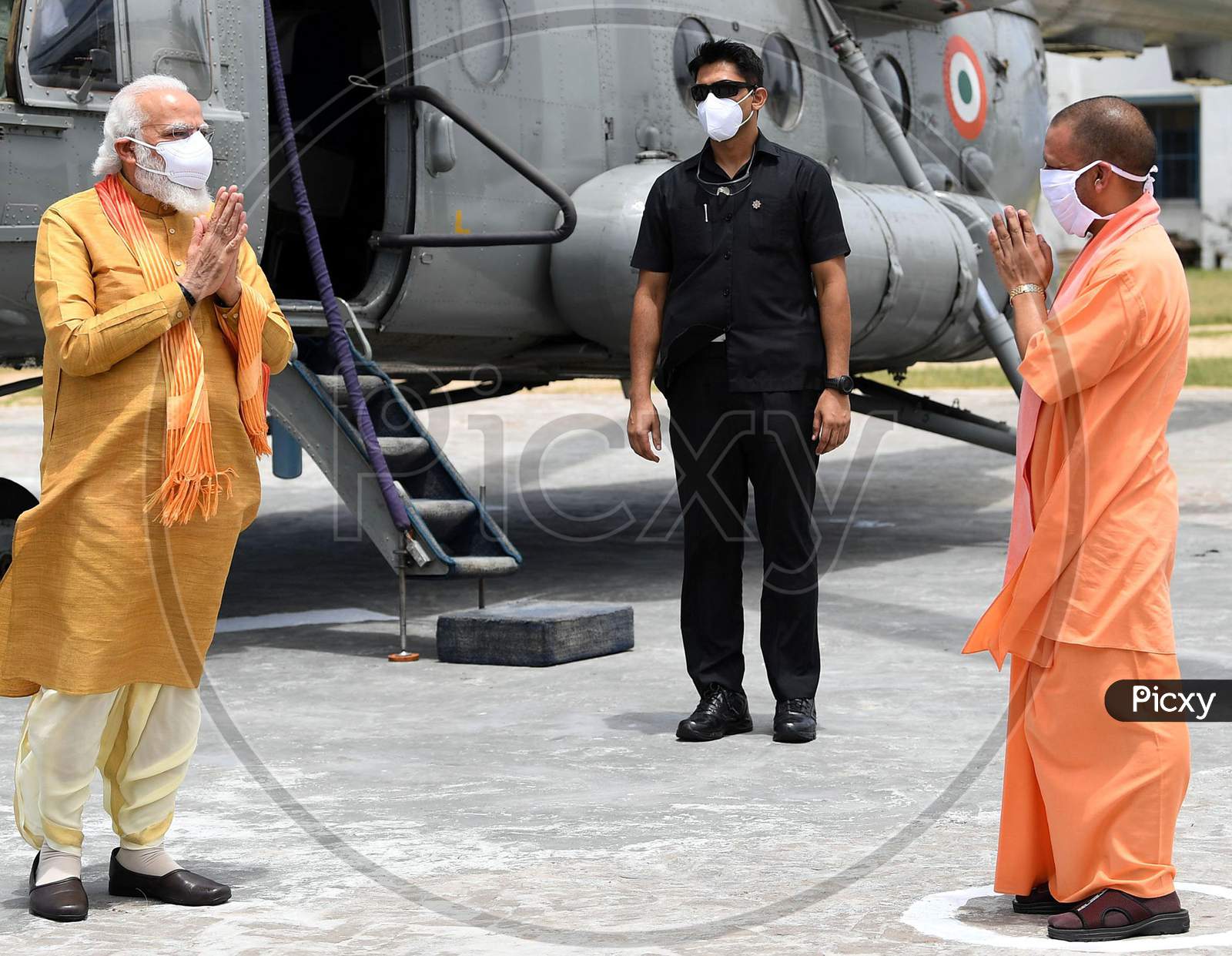 Uttar Pradesh Chief Minister Yogi Adityanath greets Prime Minister Narendra Modi as he arrives, ahead of the foundation laying ceremony for a Hindu Lord Ram's temple in Ayodhya, India, August 5, 2020.
