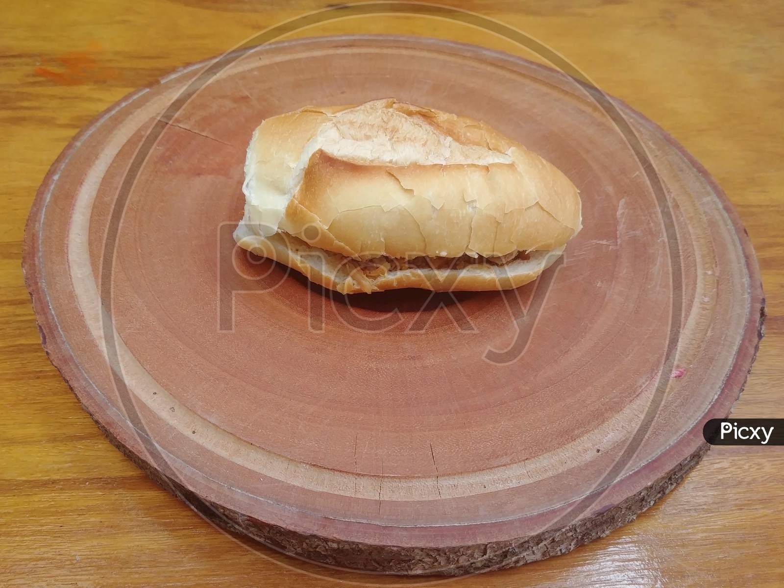 Brazilian bread with meat on wooden base