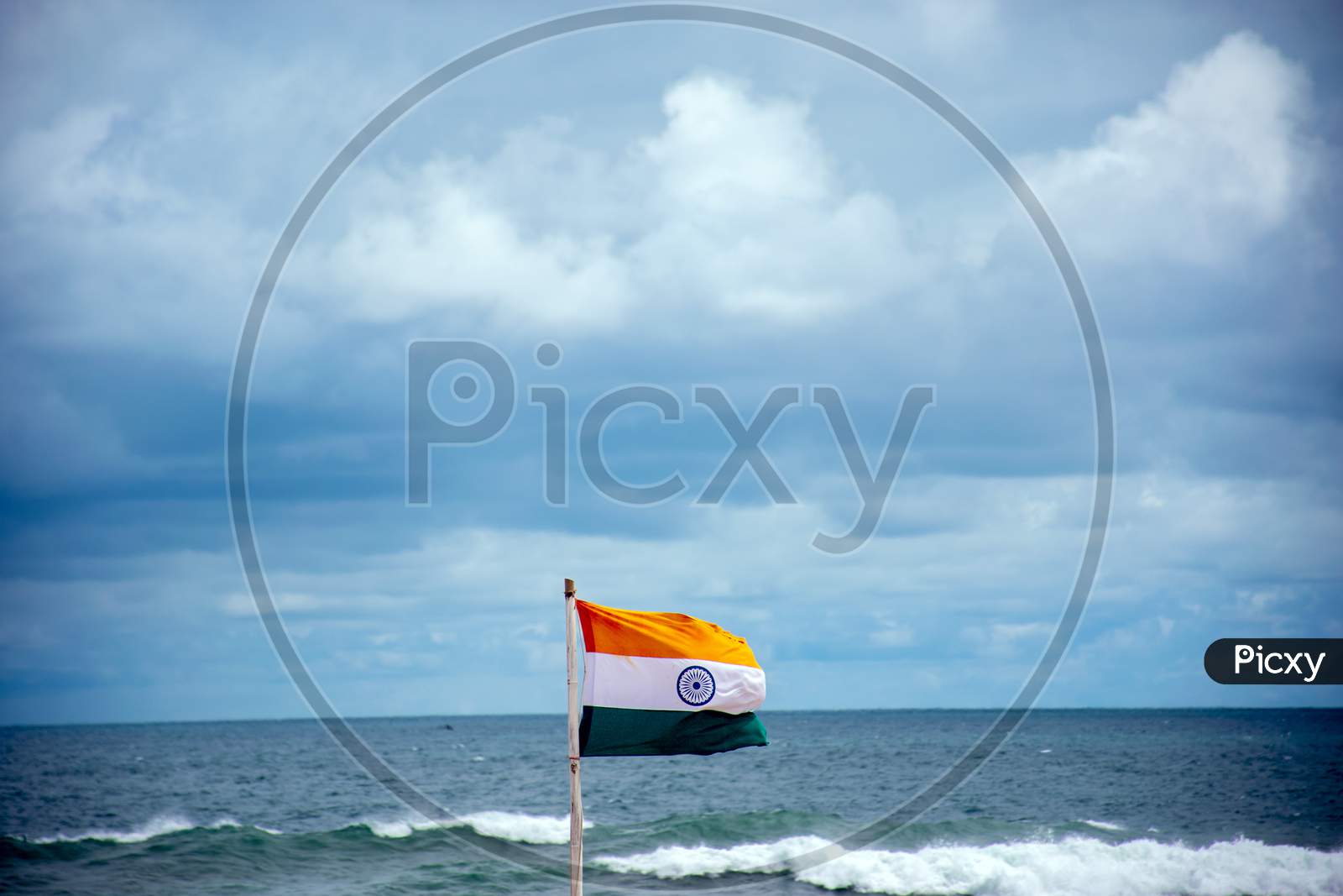 The Indian flag is waving in the sky at beautiful bay of bengal seabeach in Puri Odisha India