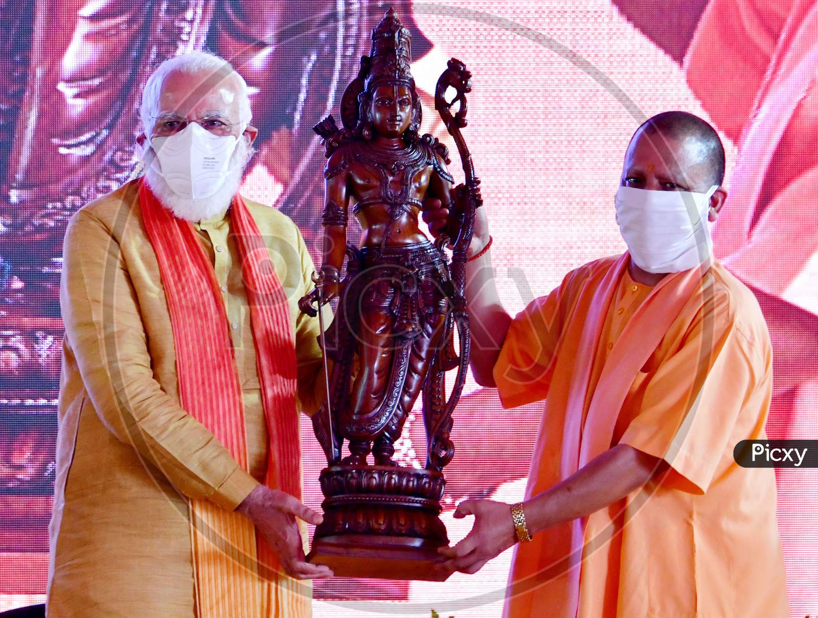 Prime Minister Narendra Modi and Uttar Pradesh Chief Minister Yogi Adityanath hold an idol of Hindu Lord Ram after the foundation laying ceremony for a Ram's temple, in Ayodhya, India, August 5, 2020.