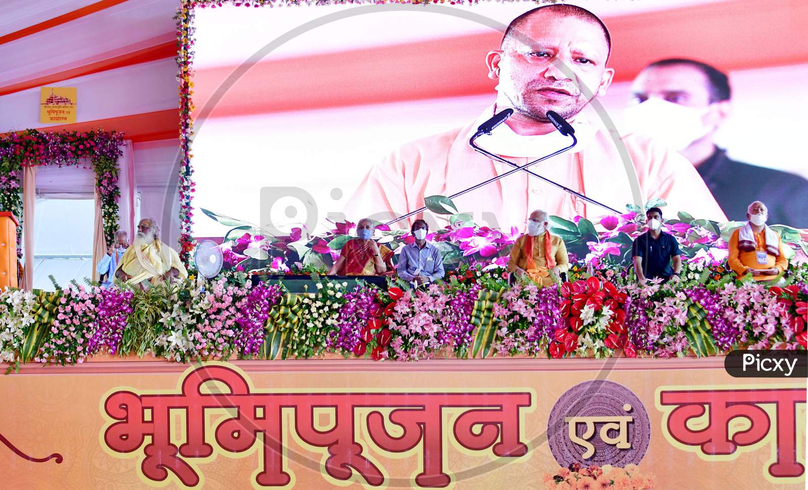 Uttar Pradesh Chief Minister Yogi Adityanath along with Prime Minister Narendra Modi, and Rashtriya Swayamsevak Sangh (RSS) chief Mohan Bhagwat, addresses people after the foundation laying ceremony for the Hindu Lord Ram's temple, in Ayodhya, India, August 5, 2020.