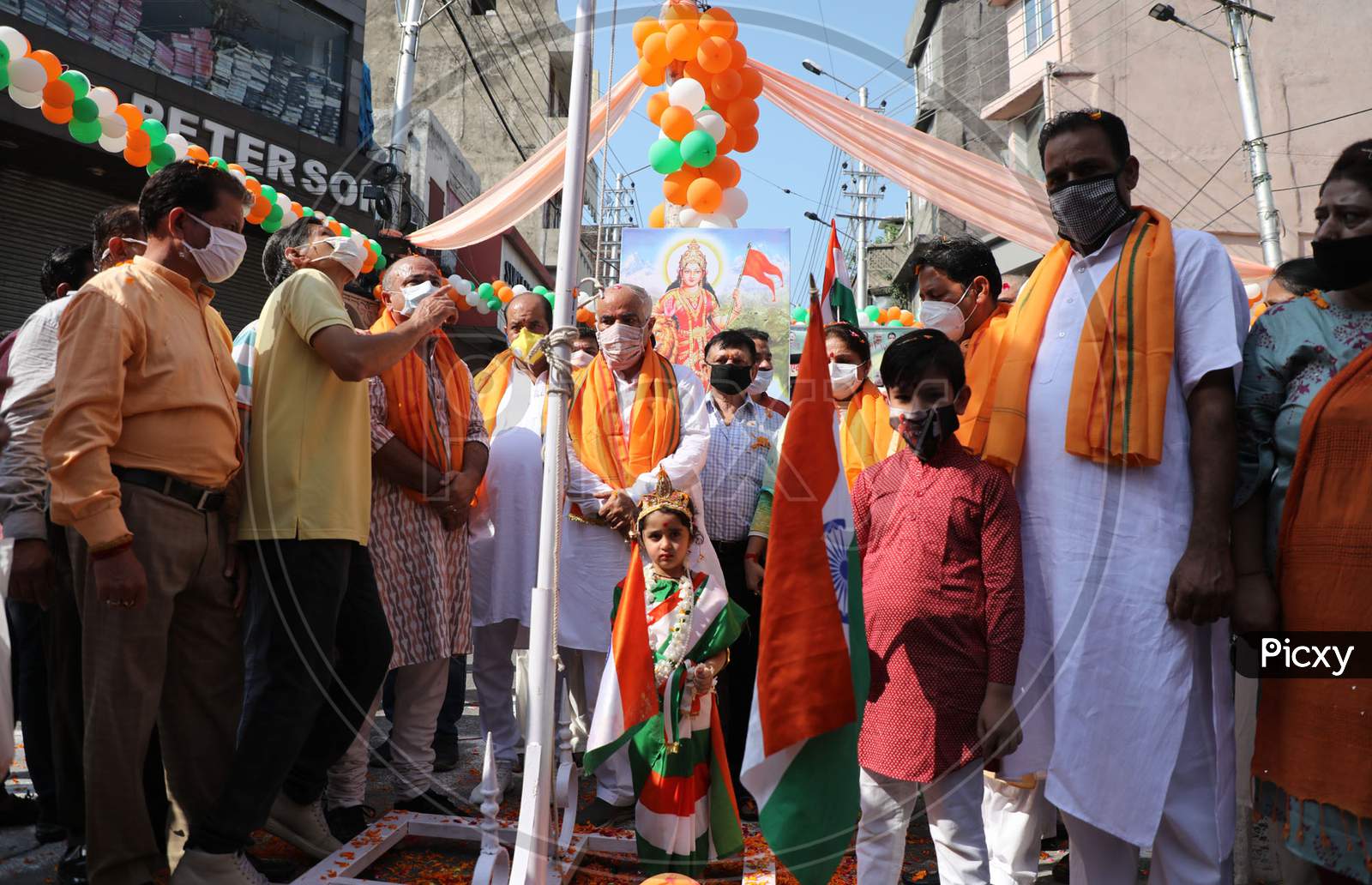 Senior BJP leaders hoist the Tricolor as they celebrate on the first anniversary of revocation of the special status of Jammu and Kashmir, in Jammu on August 5,2020.